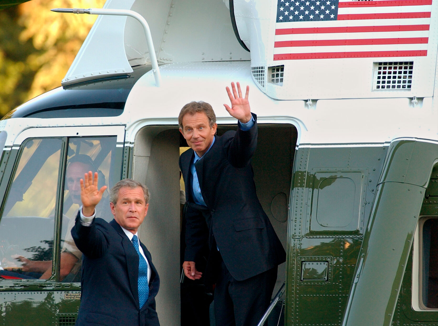 President Bush and British Prime Minister Tony Blair wave